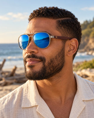 Anchor Bay polarized sunglasses worn by a man on a driftwood beach at Anchor Bay