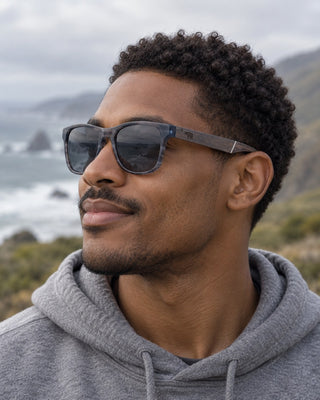 Lost Coast polarized sunglasses worn by a man on a rugged coastal trail on the Lost Coast