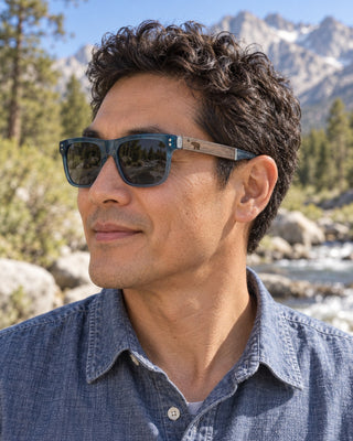 Mount Whitney polarized sunglasses worn by a man beside a mountain creek near Lone Pine