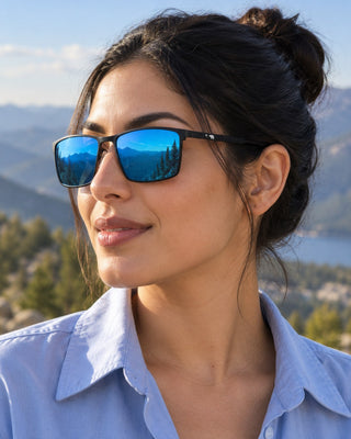 Pacific Crest polarized sunglasses worn by a woman at a scenic overlook on the Pacific Crest Trail
