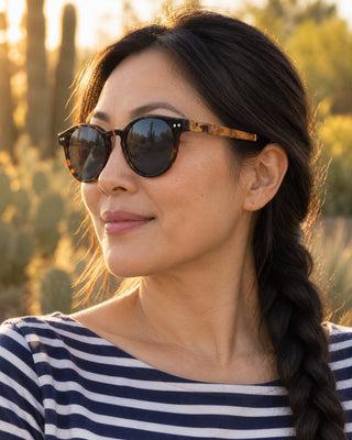 Palm Desert polarized sunglasses worn by a woman at a desert garden in Palm Desert
