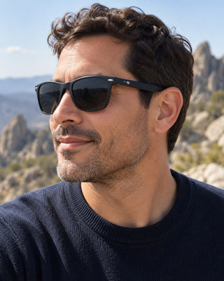 Pinnacles polarized sunglasses worn by a man at a rocky overlook in Pinnacles National Park