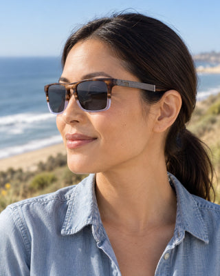 San Onofre polarized sunglasses worn by a woman on the bluff trail at San Onofre